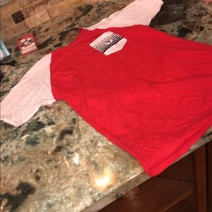 red and white “pink dolphin” shirt